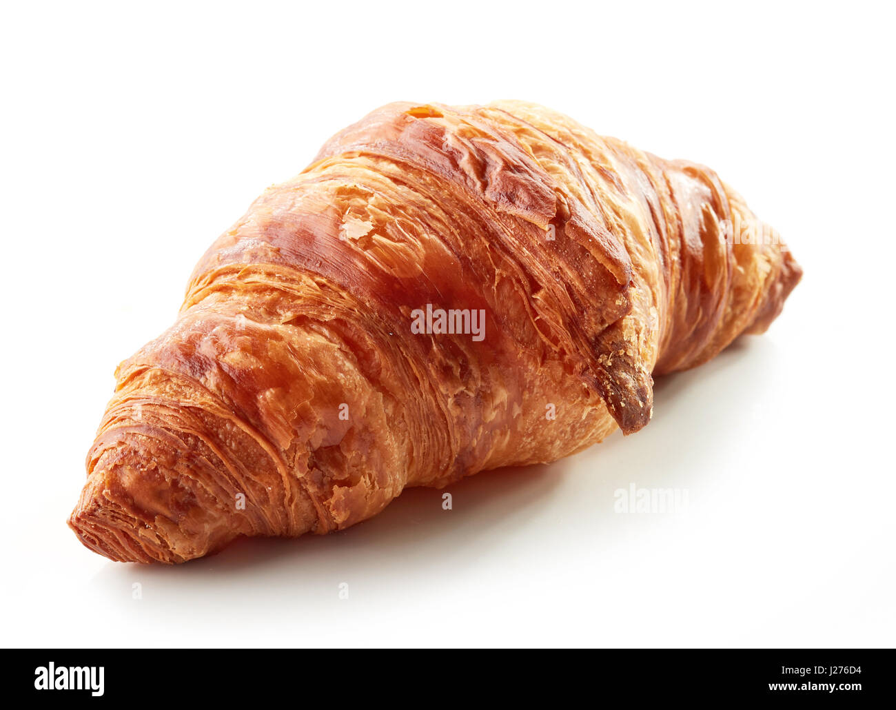 freshly baked croissant isolated on white background Stock Photo - Alamy