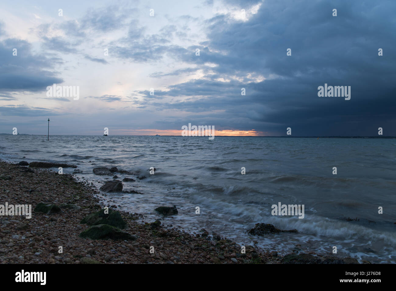 Moody Sunset & storm clouds from the Isle of Wight. Stock Photo