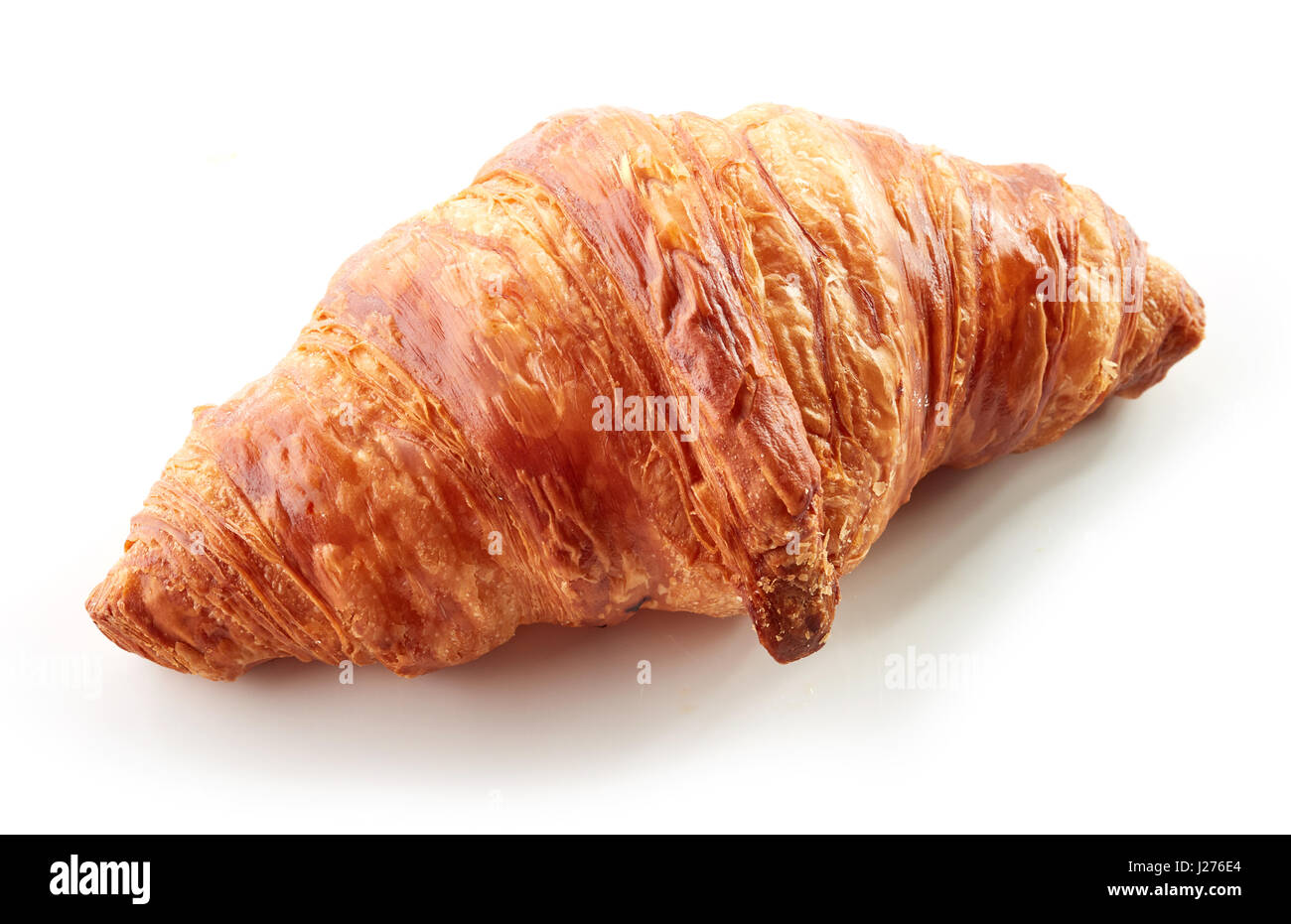 freshly baked croissant isolated on white background Stock Photo - Alamy