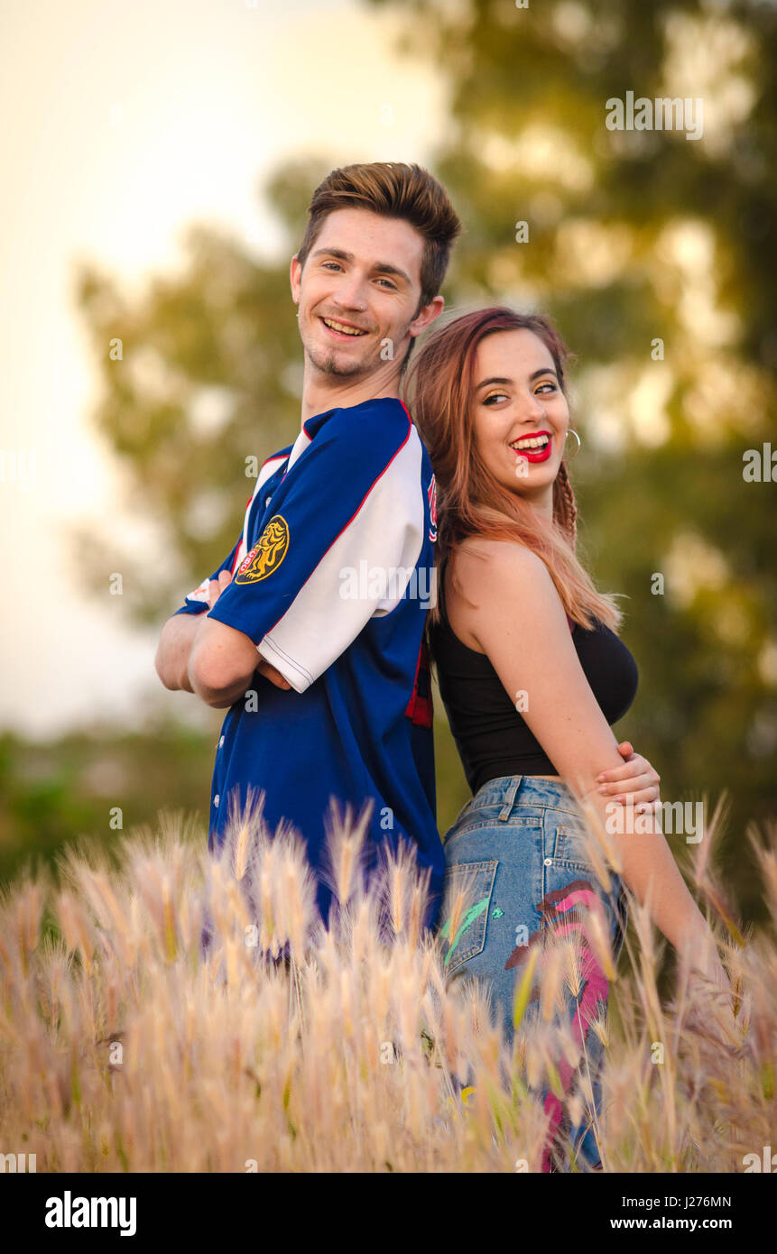 portrait of a happy young couple in summer clothes outdoor J276MN