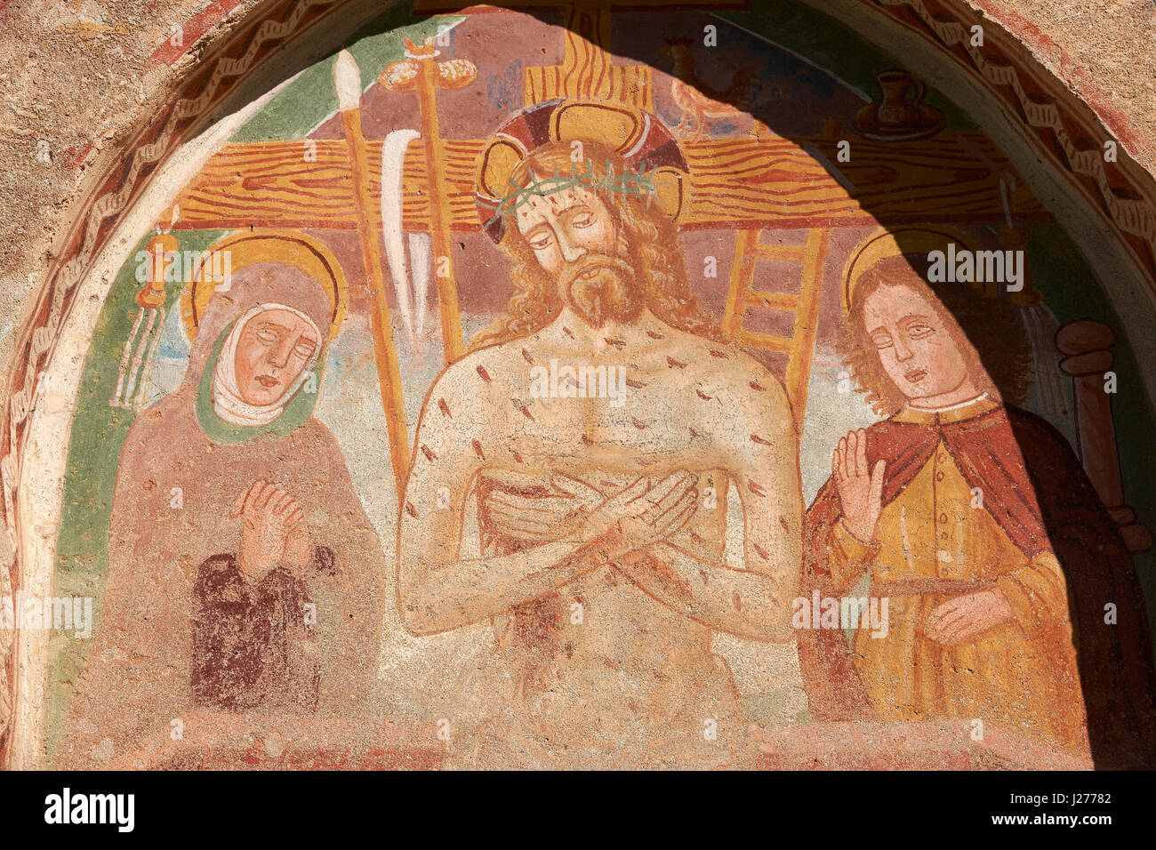 Fresco of Jesus Christ and the Cross on the church of San Vigilio in Pinzolo, Trentino, Italy Stock Photo