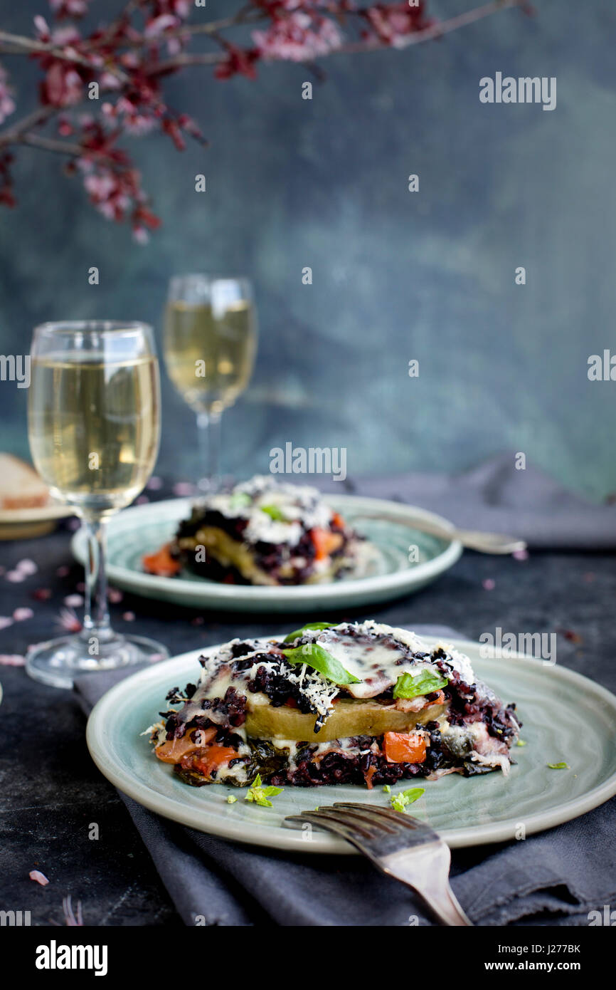 Black Rice Eggplant Parmesan sreved with white wine and bread