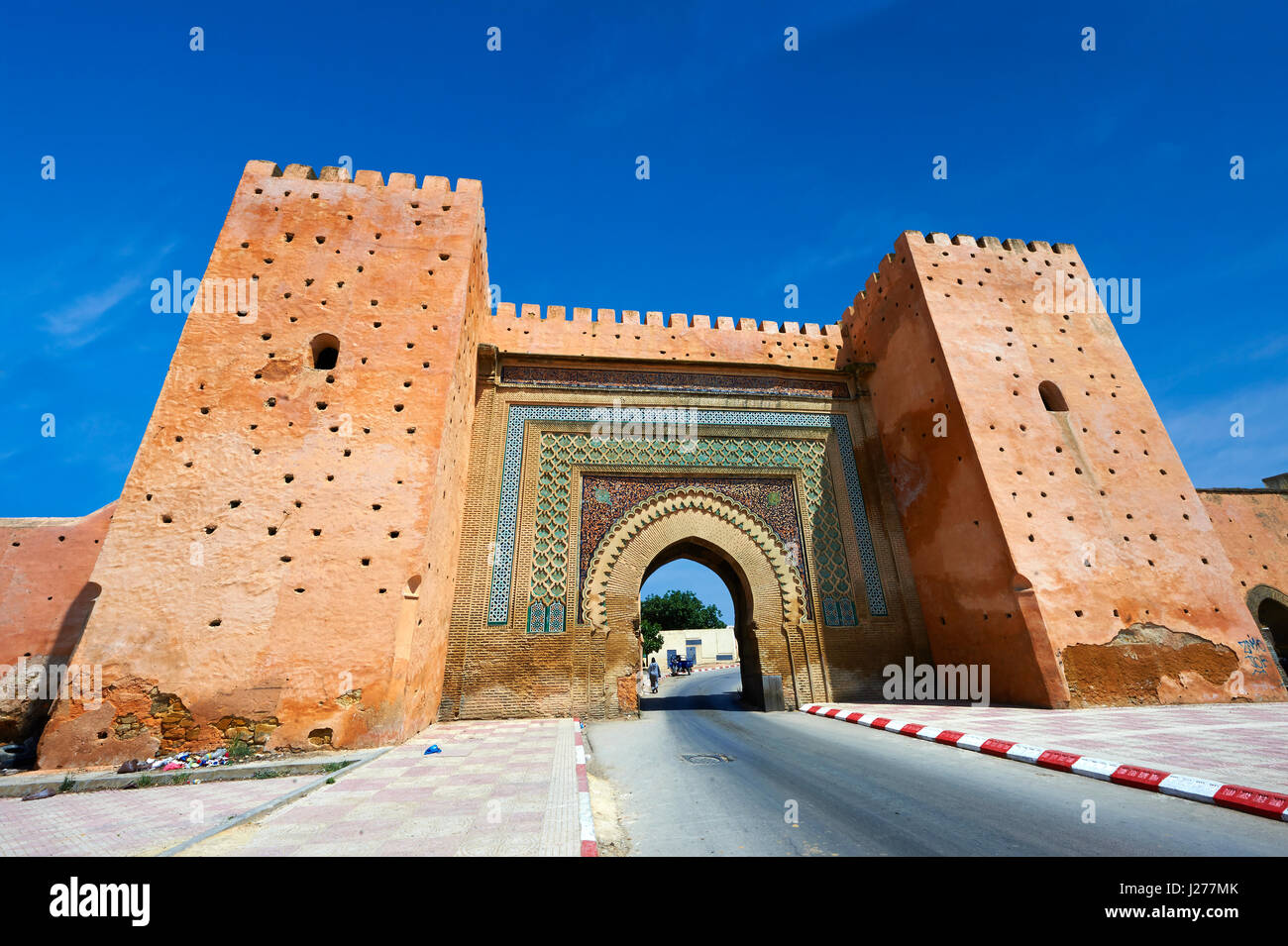 Moorish Arabesque Gate in the city walls of Meknes with zellij mosaics, Morocco Stock Photo