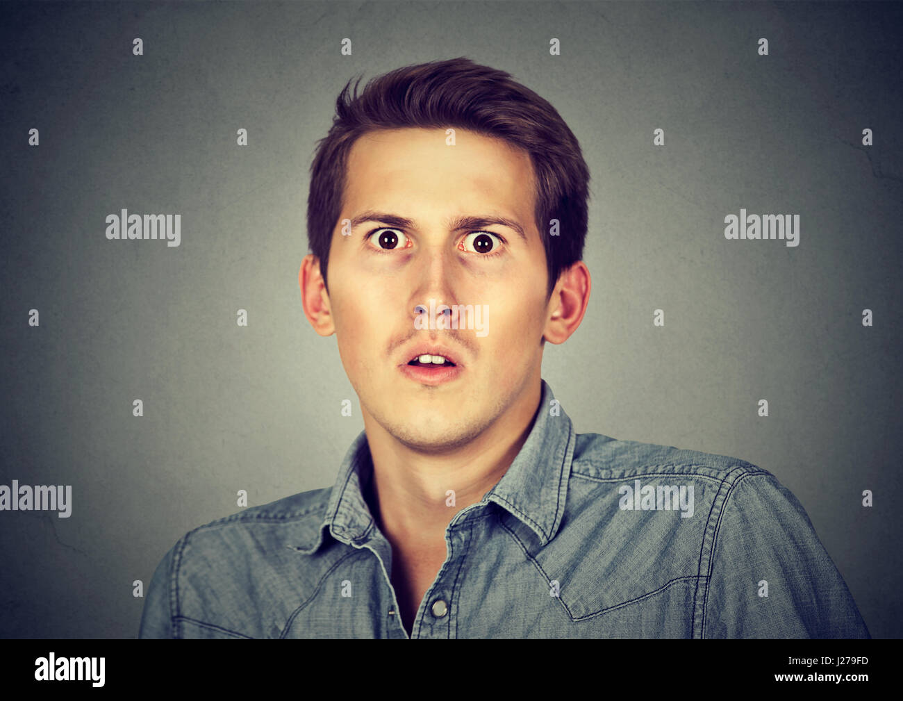 Closeup scared frightened young man Stock Photo - Alamy