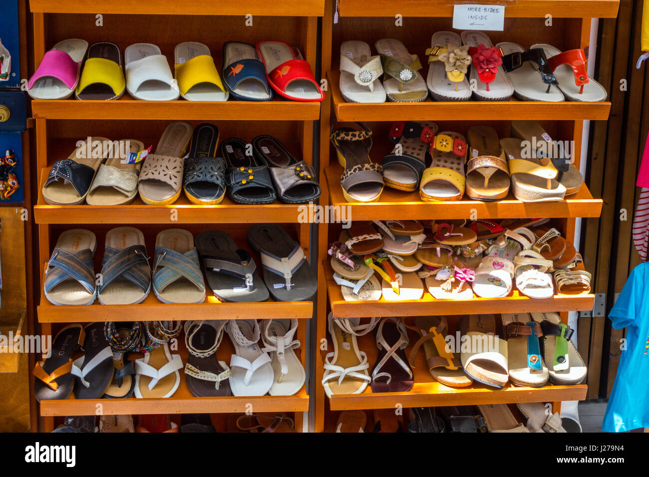 Rack of leather slippers and sandals for sale, Lindos, Rhodes, Rodos,  Greece Stock Photo - Alamy