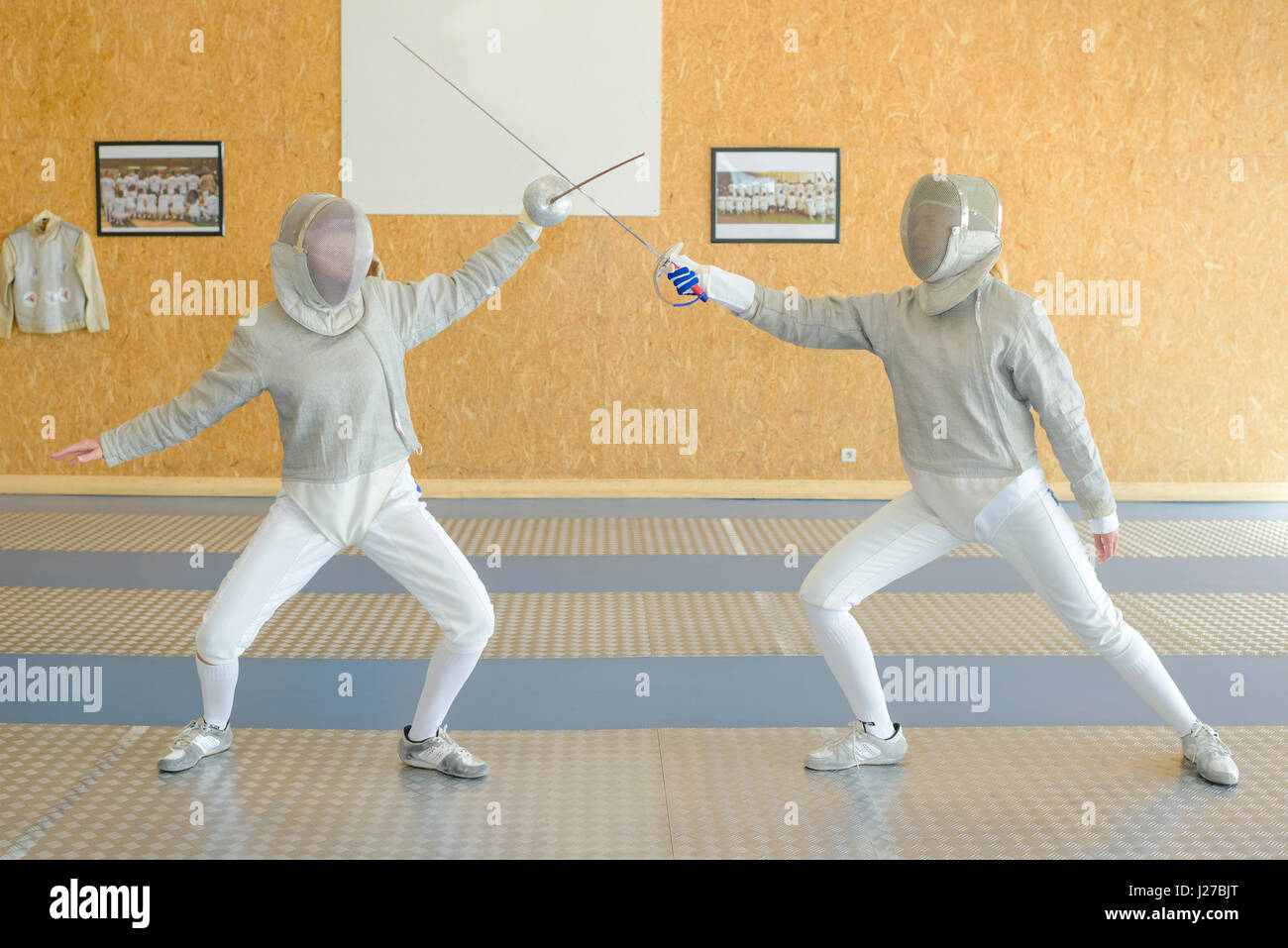 Two people fencing Stock Photo Alamy