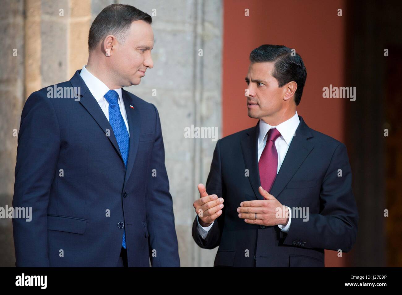 Mexican President Enrique Pena Nieto, right, chats with Polish President Andrzej Duda during a bilateral signing ceremony at the national palace April 24, 2017 in Mexico City, Mexico. Stock Photo