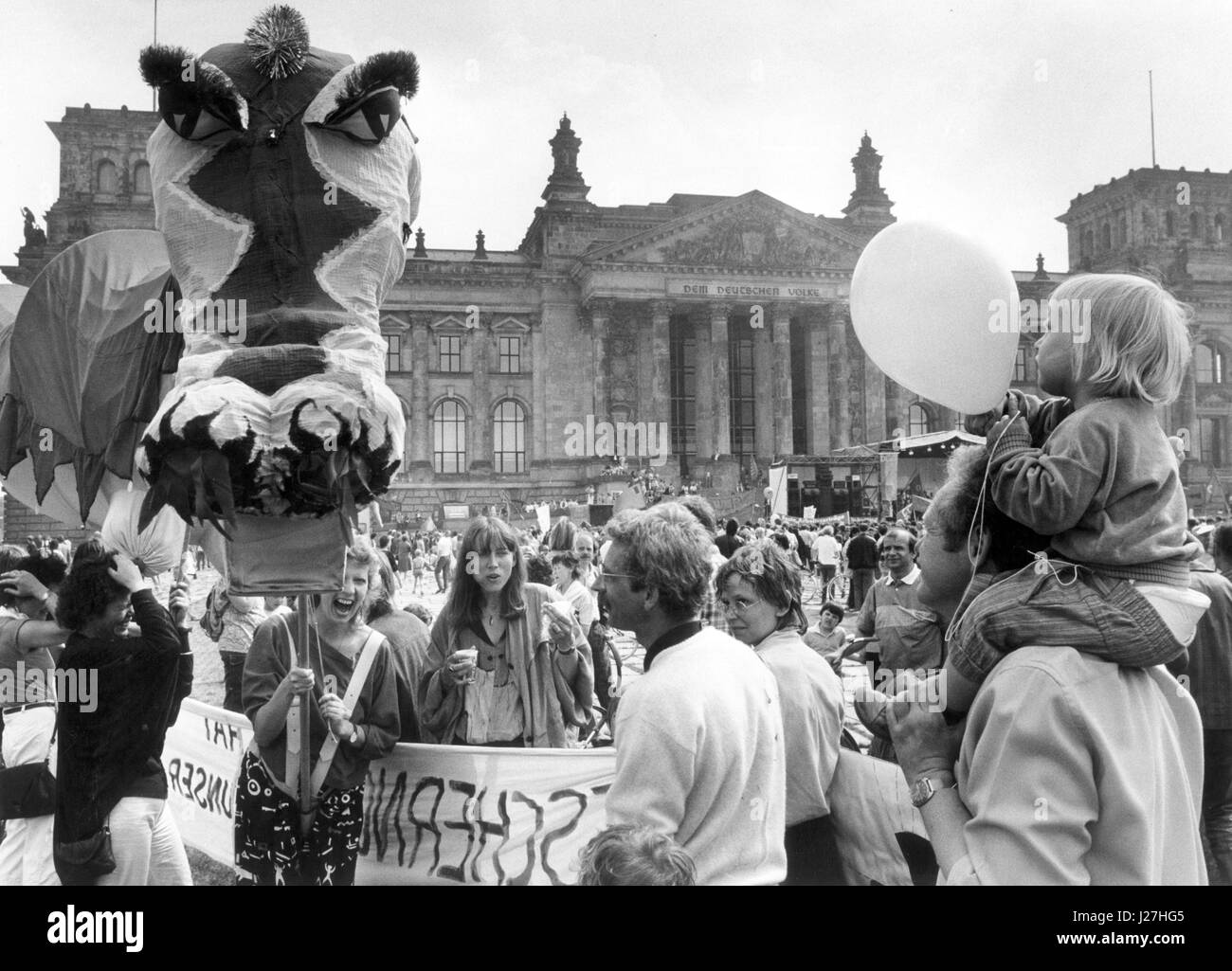 FILE - 50,000 participants with children, banners and a dragon figure gather in front of the Reichstag building for the central demonstration of the 'Deutscher Gewerkschaftsbund' (lit. 'German Union Association', DGB) in West-Berlin, Germany, 1 May 1987. Photo: dpa/dpa Stock Photo