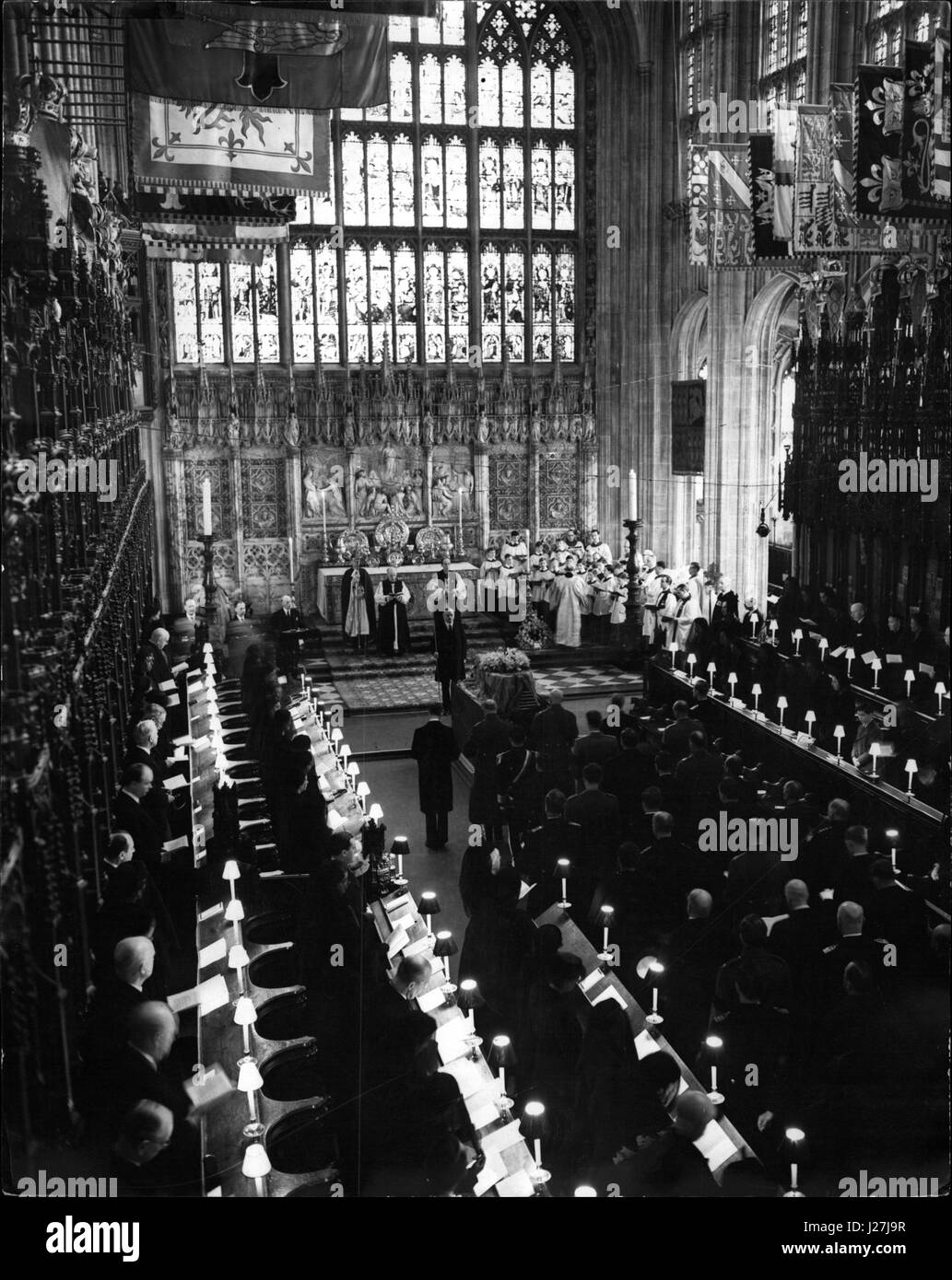 Mar. 03, 1953 - Queen Mary: The Final Scene: The scene, sombre and impressive, at the funeral service of Queen Mary in St. George's Chapel, Windsor today (Tuesday). Been in paw on right of picture are (left to right), The Queen Elizabeth the Queen mother and Princess Margaret. Standing before the coffin are (left to right) The Duke of Kent; The Duke of Golucerster; The Earl of Athlone, Queen Mary's brothers; and theDuke of Windsor. Before the alter the Archbishop of Canterbury, Dr. Goeffrey Fischer (center). is seen conducting the service. (Credit Image: © Keystone Press Agency/Keystone USA vi Stock Photo