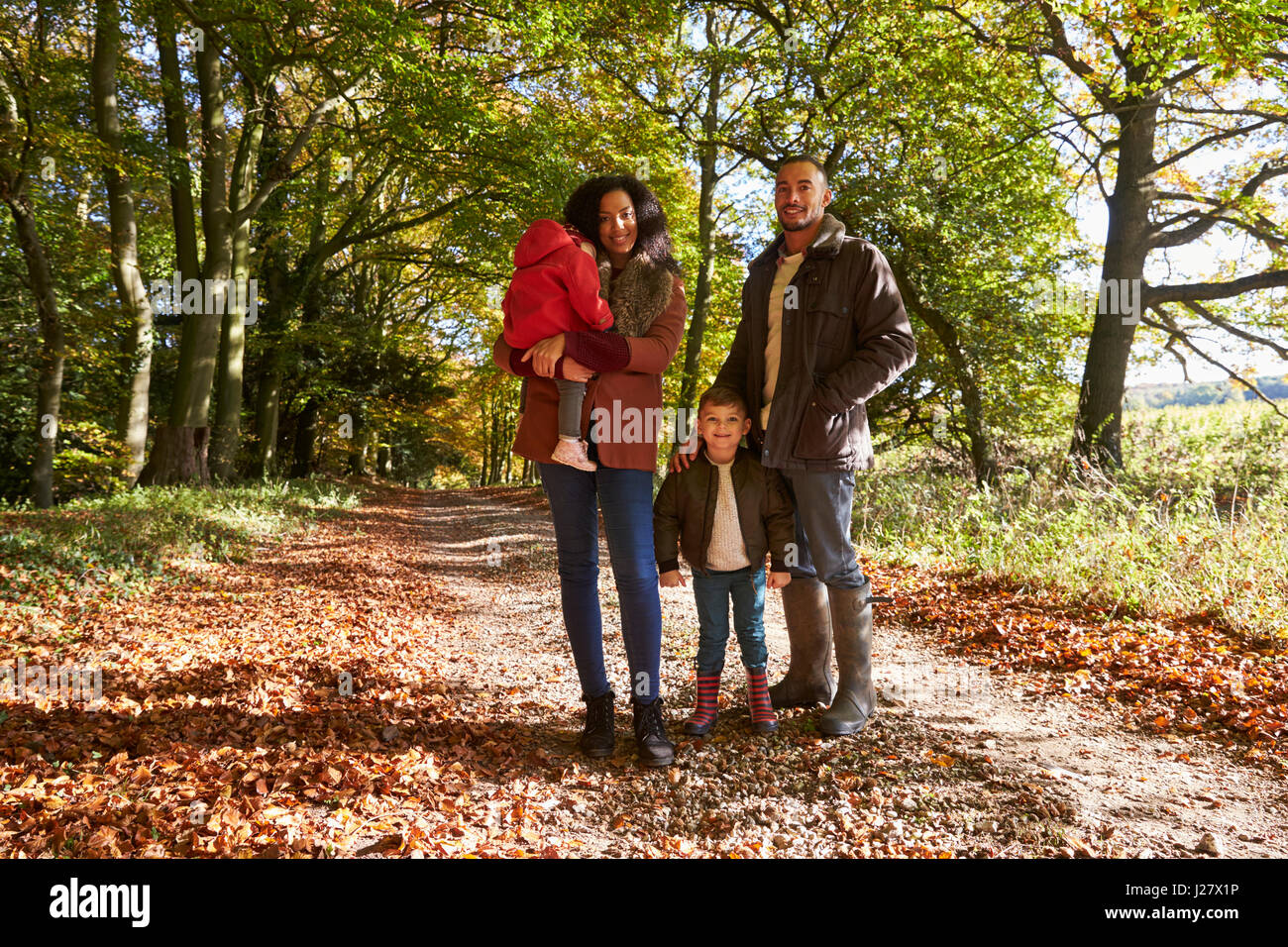 Portrait Of Family On Autumn Walk In Woodland Together Stock Photo - Alamy