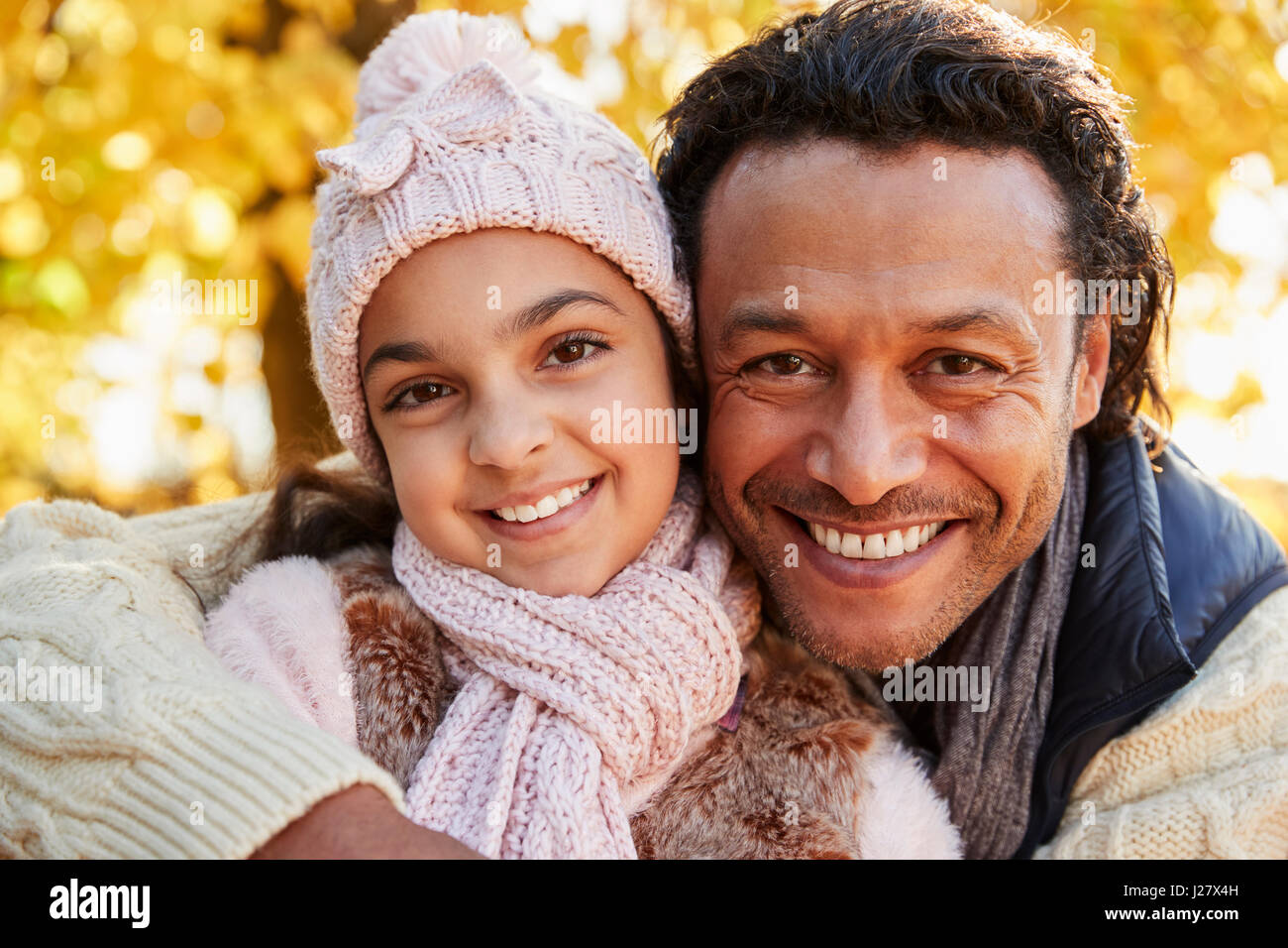 Outdoor Autumn Portrait Of Father With Daughter Stock Photo