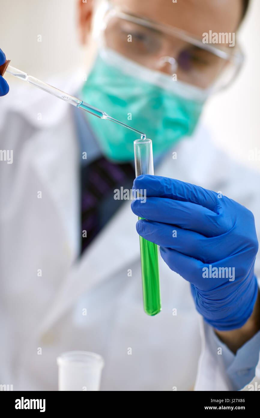 scientist researching in the laboratory with test tubes Stock Photo