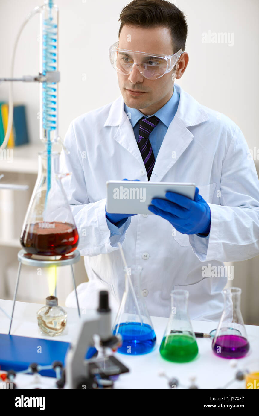 young scientist using data in laboratory Stock Photo