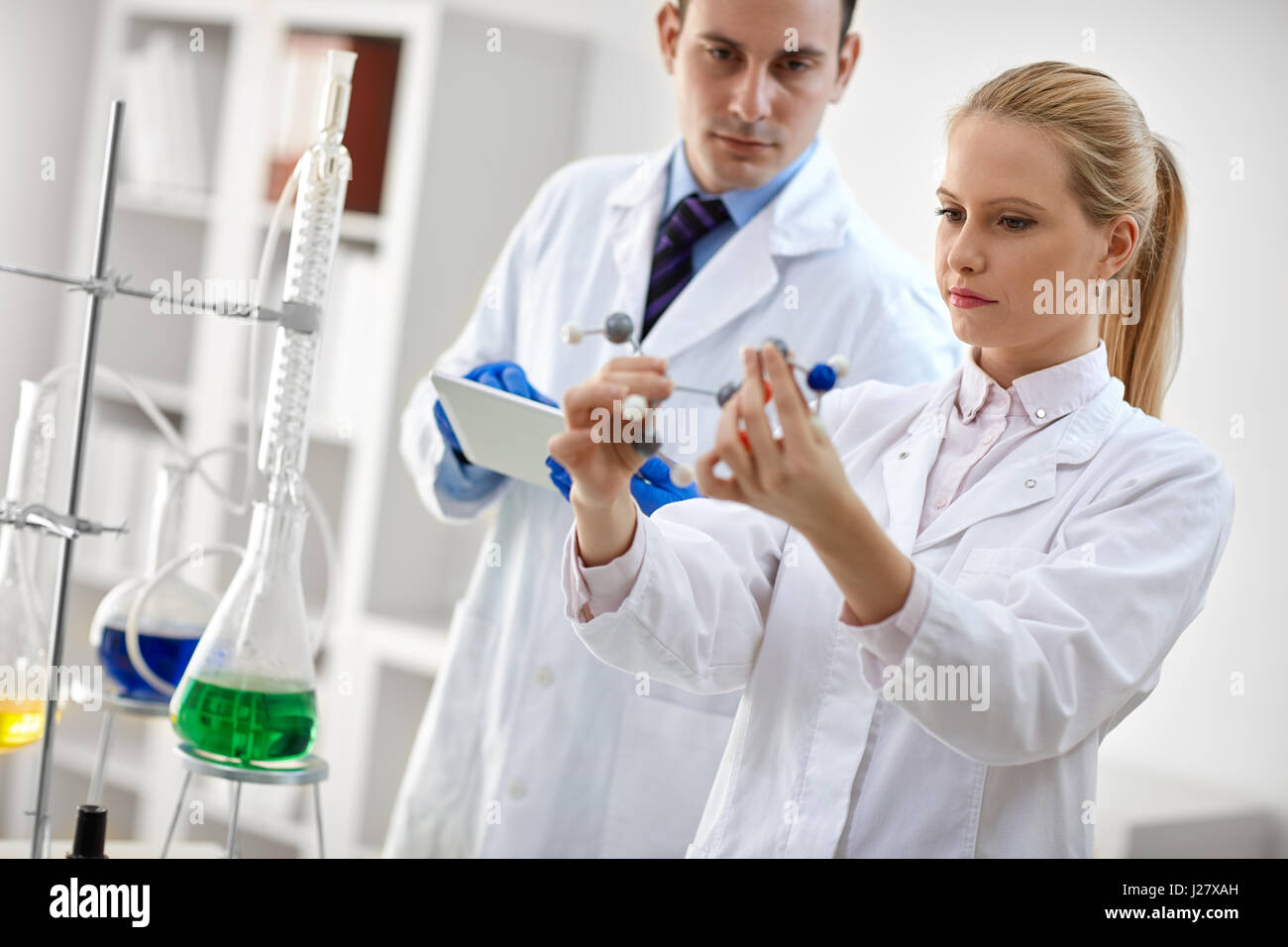 students chemists studying molecular model in chemical lab Stock Photo