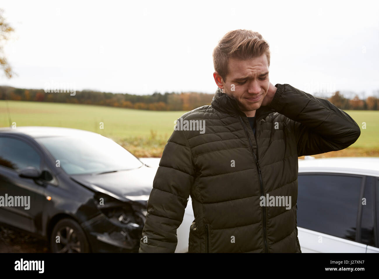 Man Suffering With Whiplash Injury After Car Accident Stock Photo