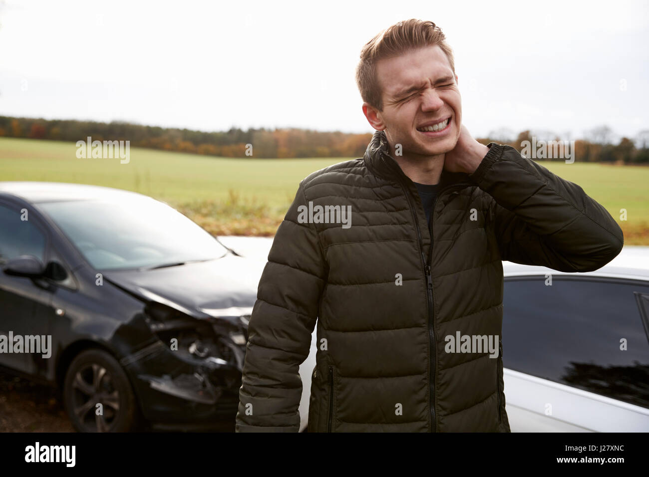 Man Suffering With Whiplash Injury After Car Accident Stock Photo