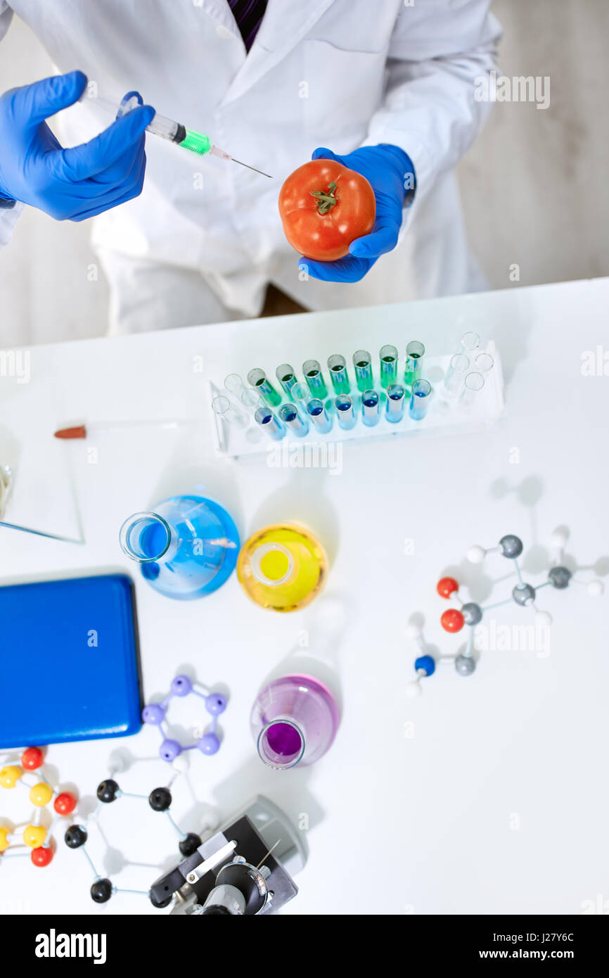 Science Modifications Scientist genetically modifying vegetables in the laboratory Stock ...