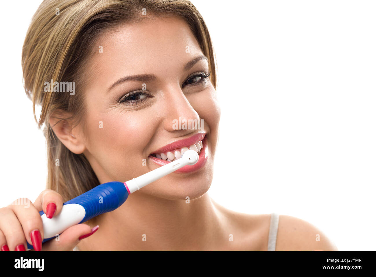 Young beautiful woman brushing her healthy teeth, oral hygiene Stock