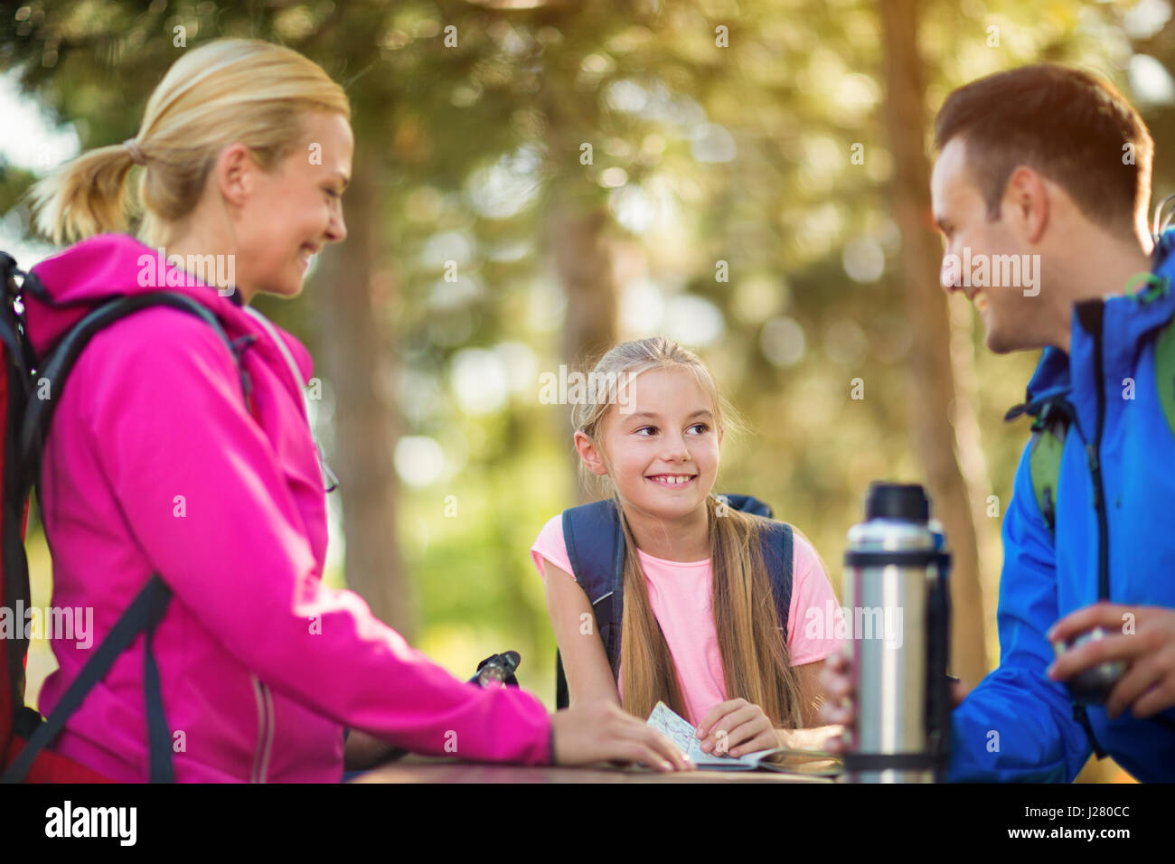 child girl in the forest with parents on hiking Stock Photo - Alamy