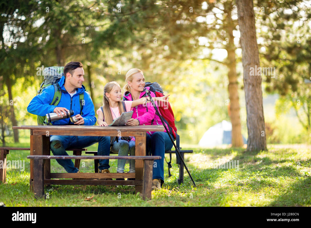 hiker family look something interesting in the forest Stock Photo
