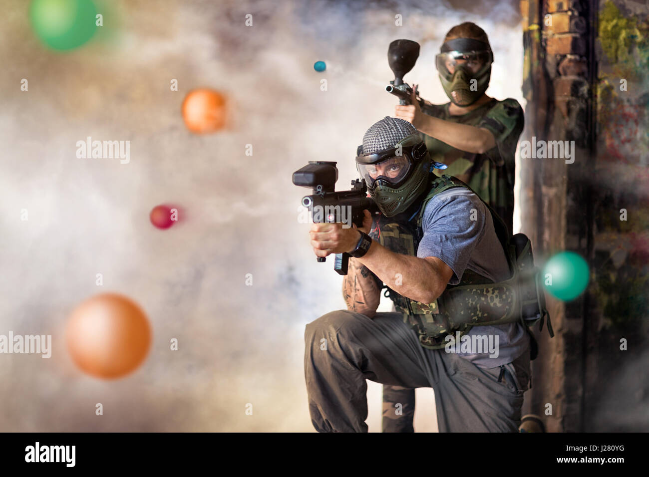 Play paintball game, two player with guns Stock Photo