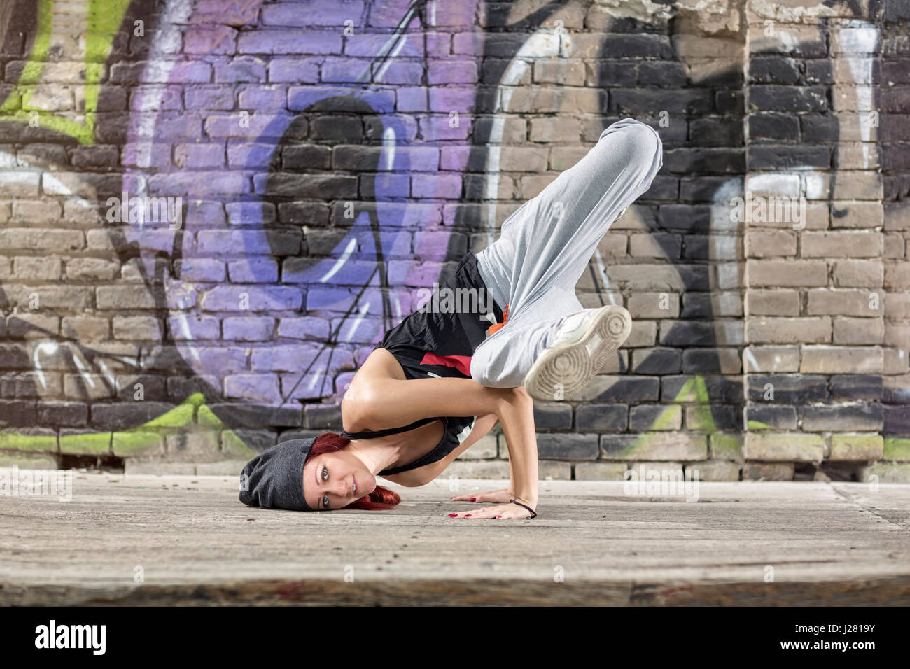 Nice flexible girl perform street dance Stock Photo