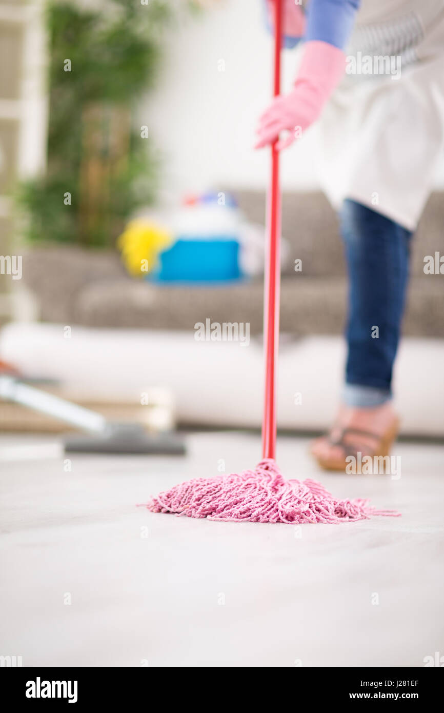 Wiping floor in action during cleaning house Stock Photo Alamy