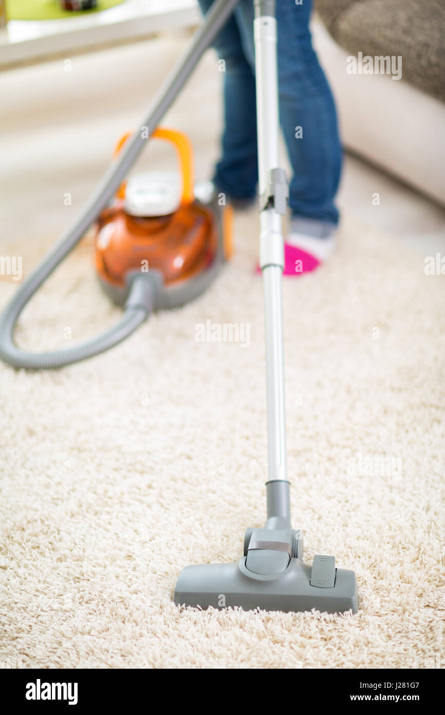 Vacuuming carpet hires stock photography and images Alamy