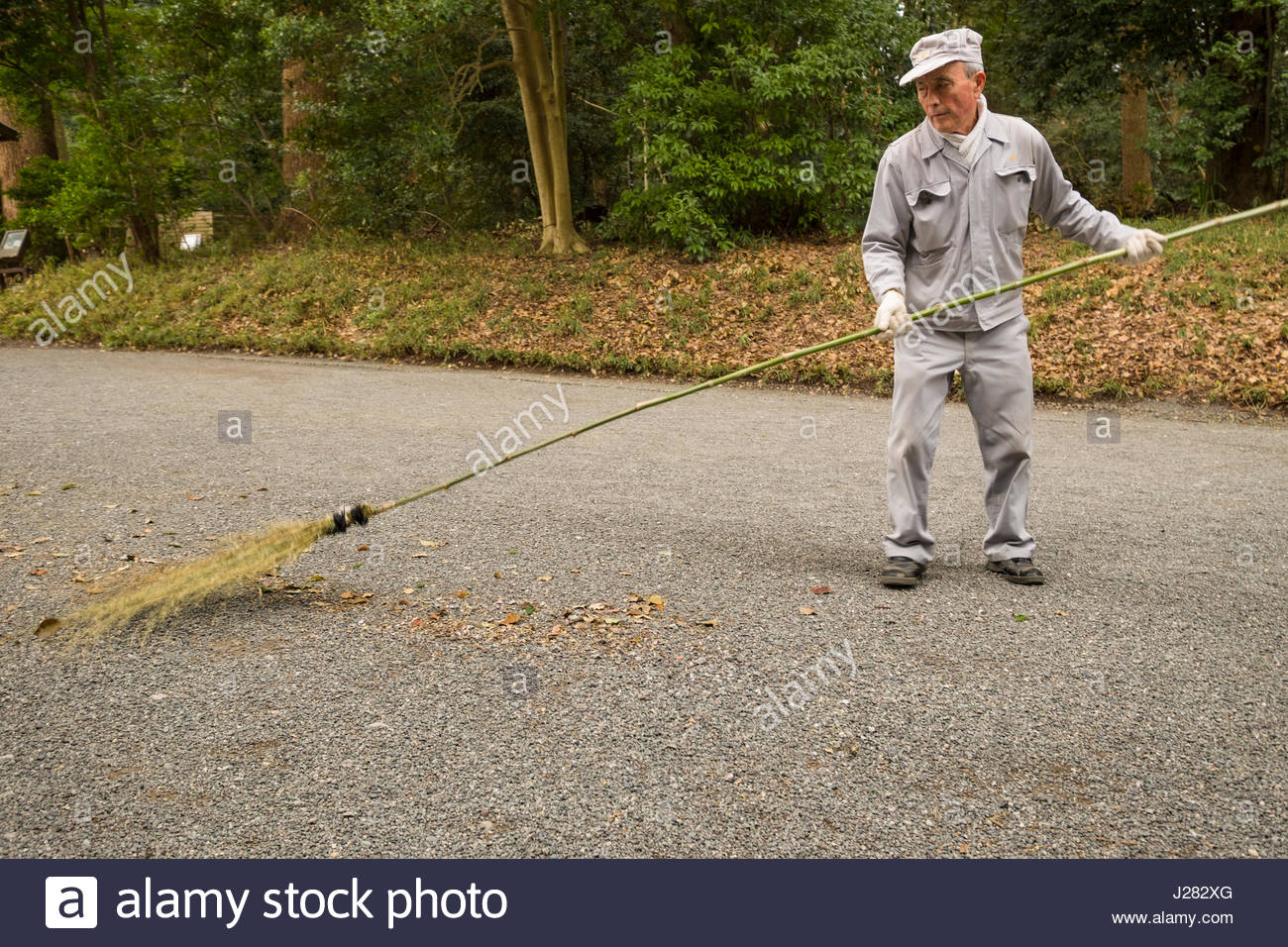 Broom Sweeping Leaves High Resolution Stock Photography and Images Alamy