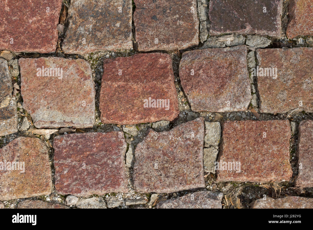 Old style bricks or paving stone for a sidewalk or street. Stock Photo