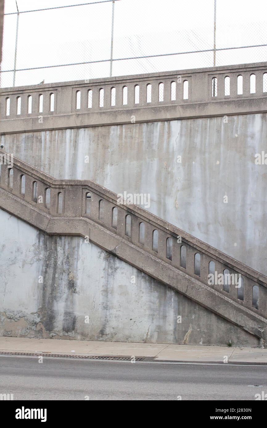 Old style concrete stairs and railing along a city street. Stock Photo