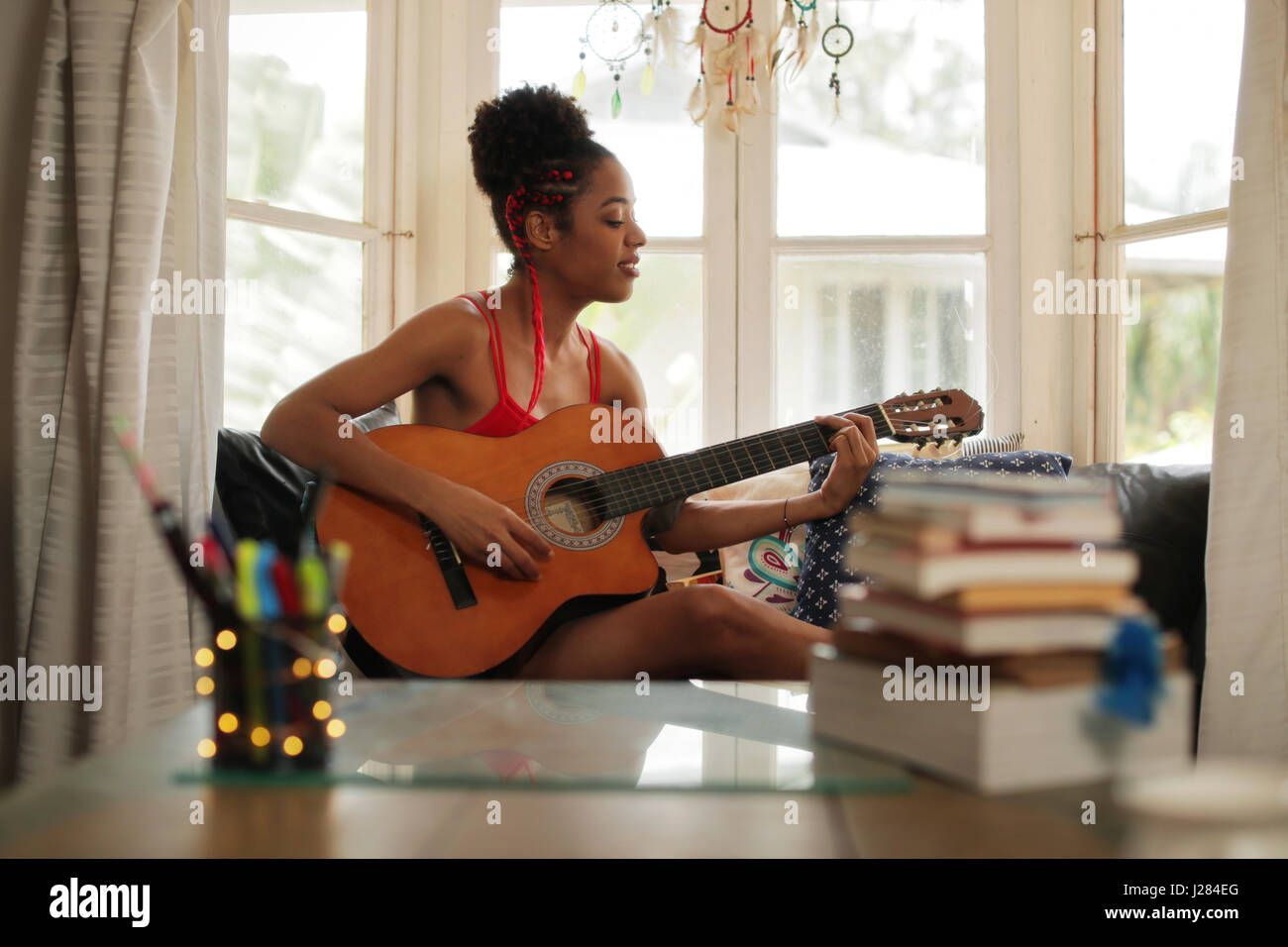 Black Girl Lying On Couch And Singing Song Young African American