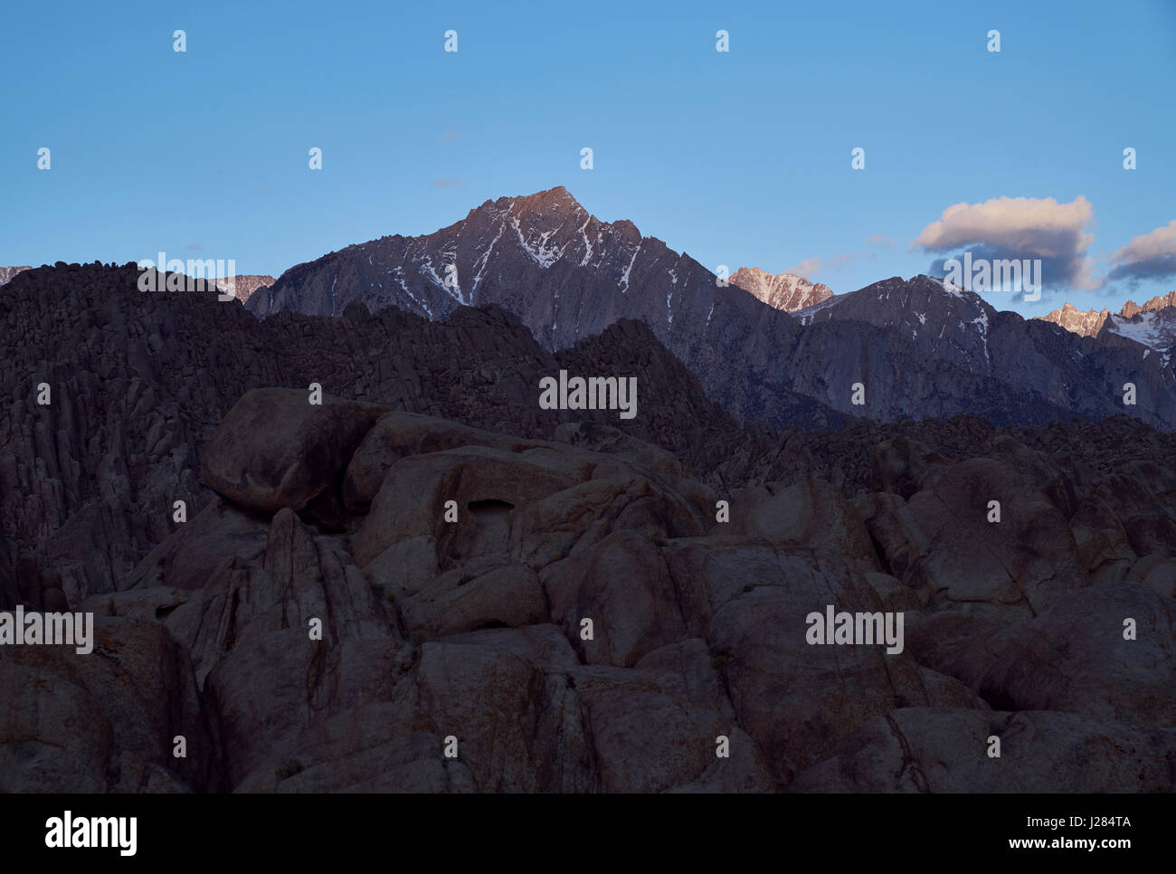 Scenic view of Alabama Hills against blue sky Stock Photo