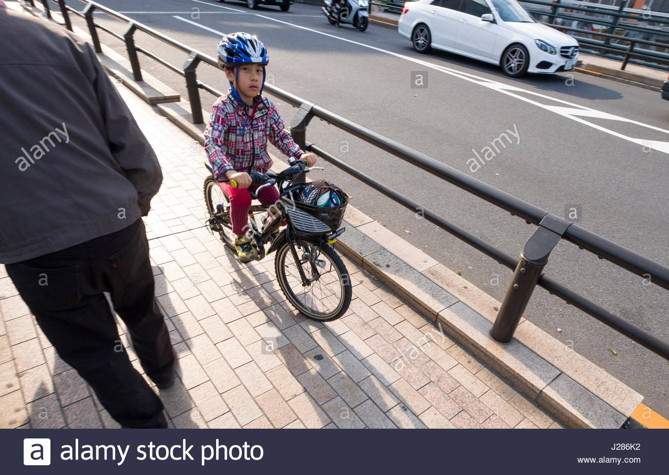 riding bicycle on sidewalk