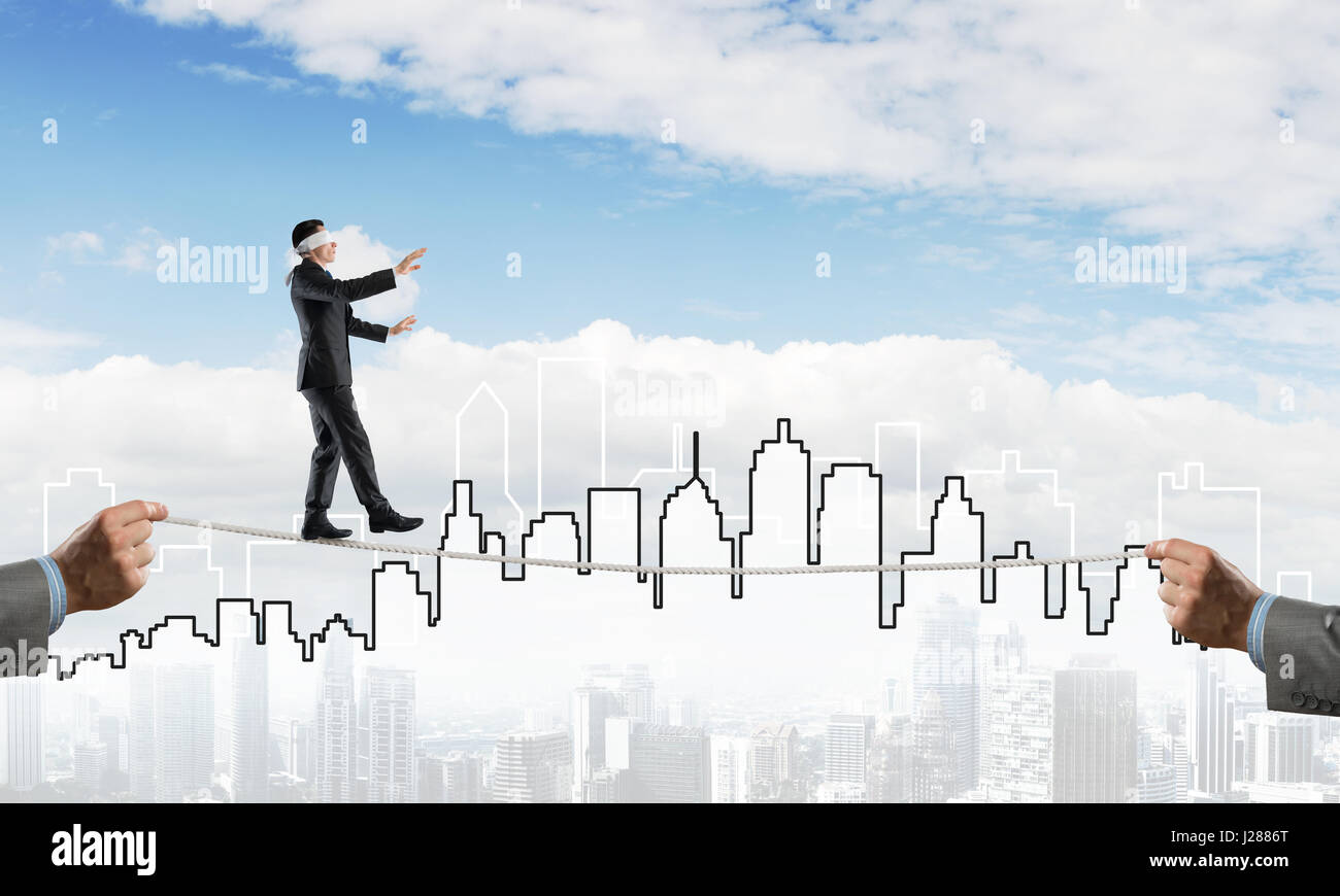 Business concept of risk support and assistance with man balancing on ...