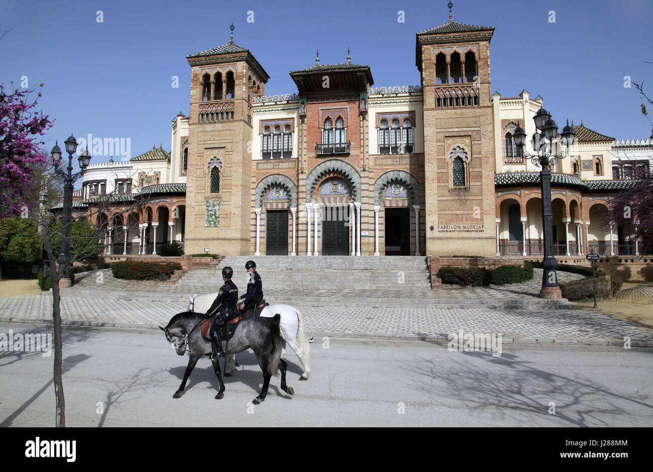 Mounted police at Museum of Arts and Traditions of Sevilla Museo de Artes y Costumbres Populares Seville, Andalusia Spain María Luisa Park Stock Photo