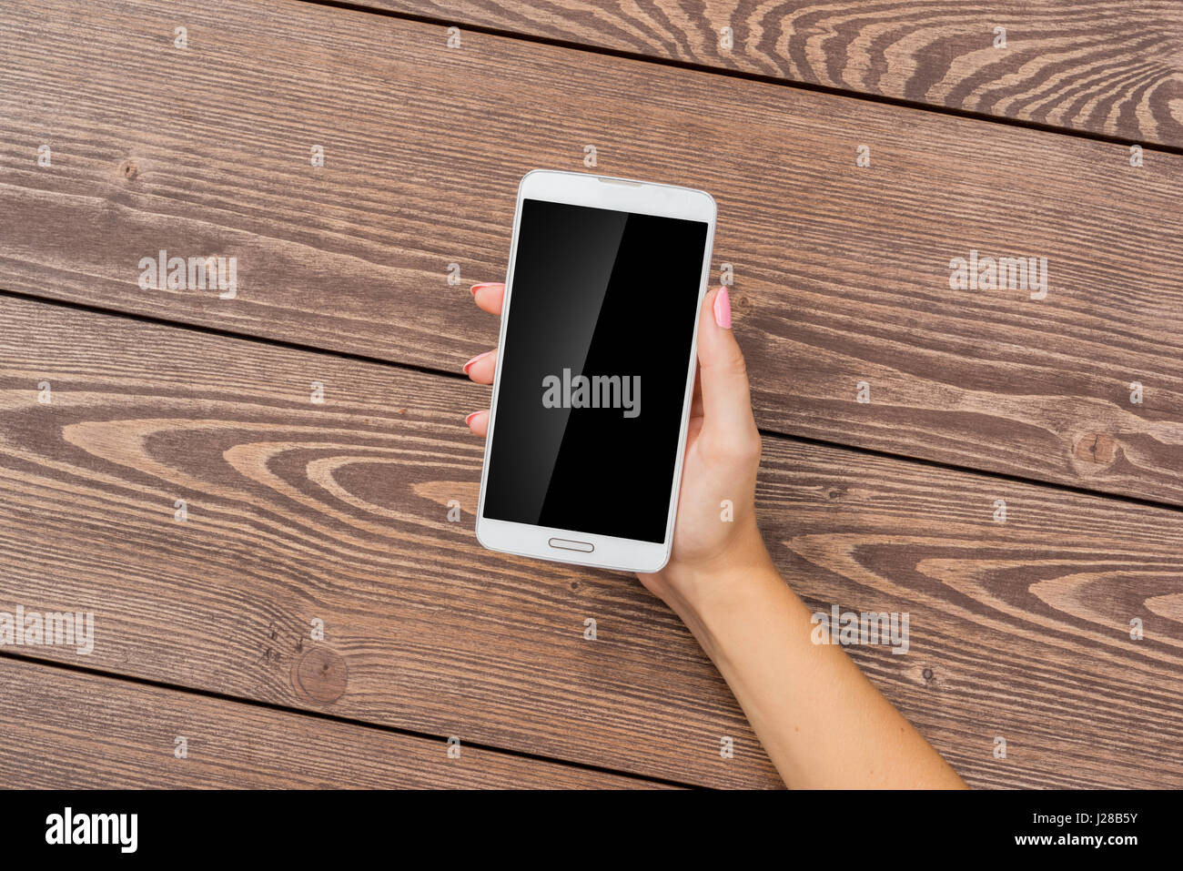 Female hand using white smart phone Stock Photo - Alamy