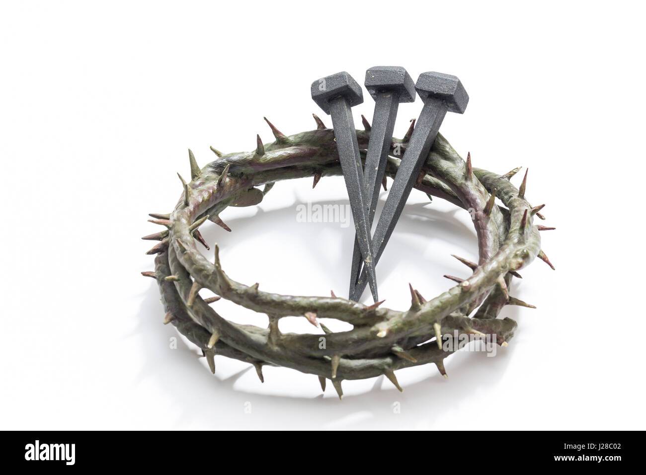 Passion Of Jesus Christ - Hammer And Bloody Nails And Crown Of Thorns On  Arid Ground With Defocused Background Stock Photo - Alamy