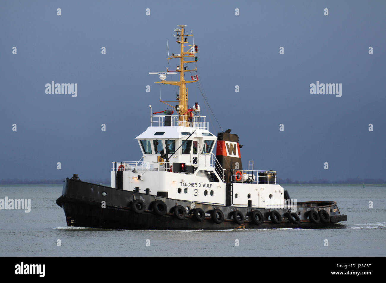 tugboat TAUCHER O. WULF 3 on the river Elbe Stock Photo