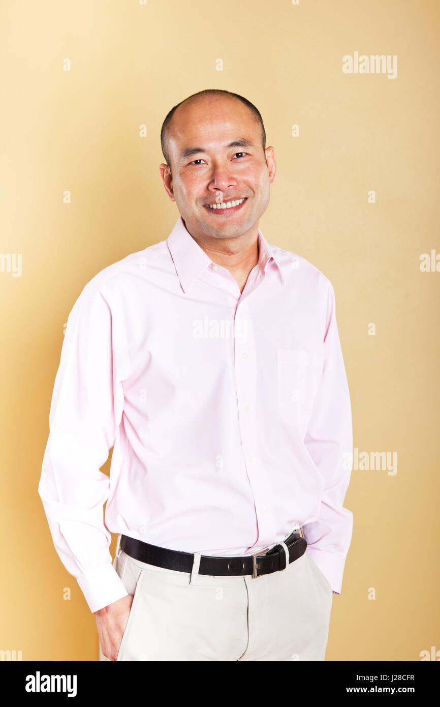 A portrait of a happy Asian businessman Stock Photo - Alamy