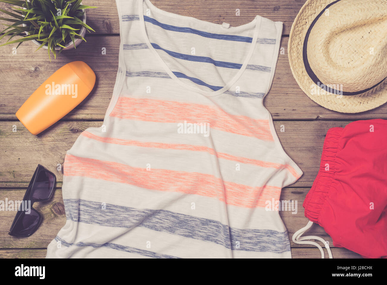 Men's beach clothes and accessories on wooden table Stock Photo Alamy