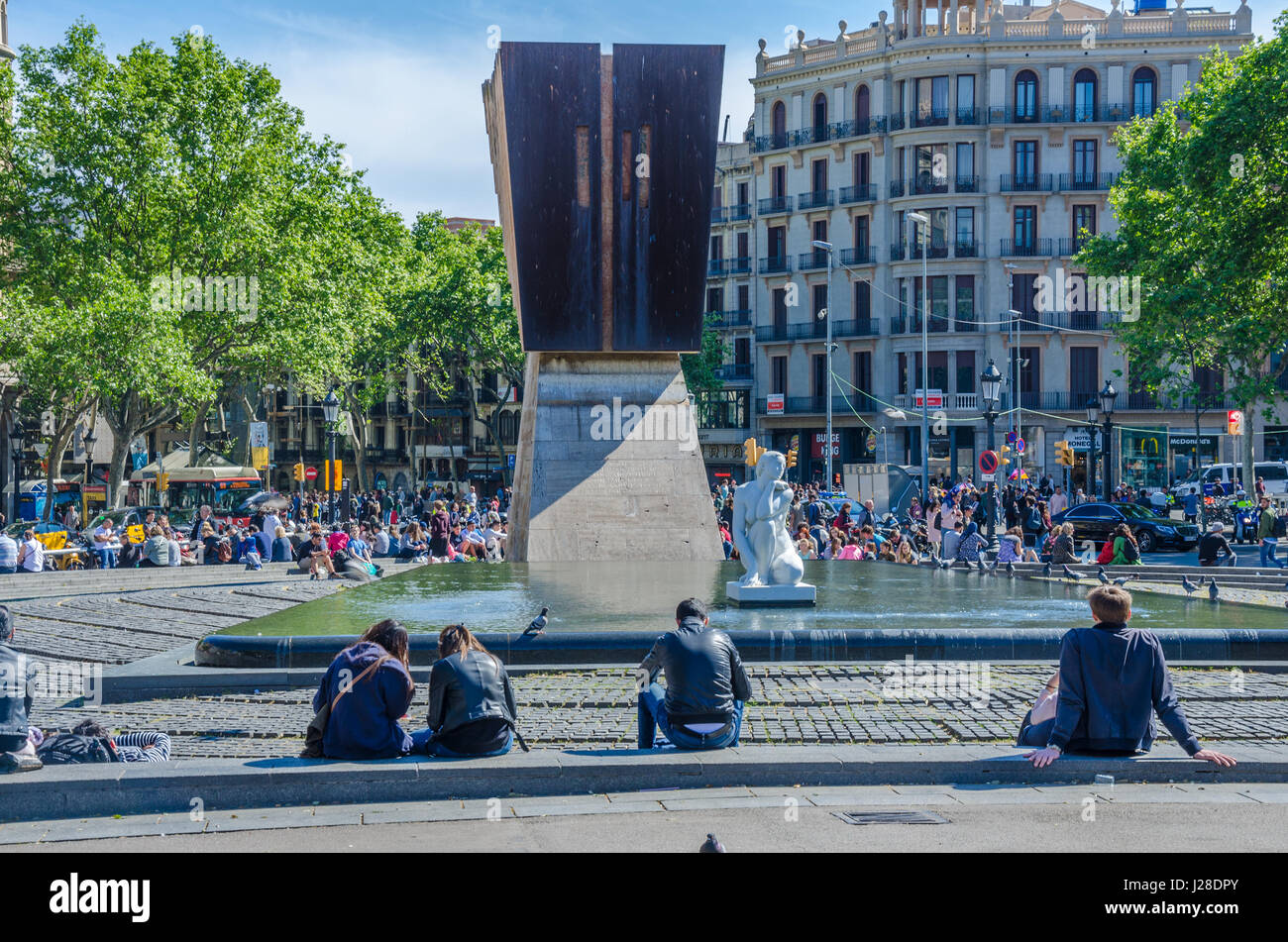 The Placa de Catalunya sits at the heart of Barcelona, surrounded by shops, it boasts fountains and statues. Stock Photo