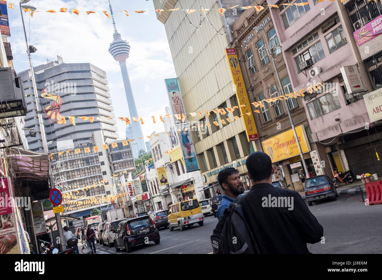 The KL Tower is seen through the buildings in downtown Kuala Lumpur, Malaysia Stock Photo