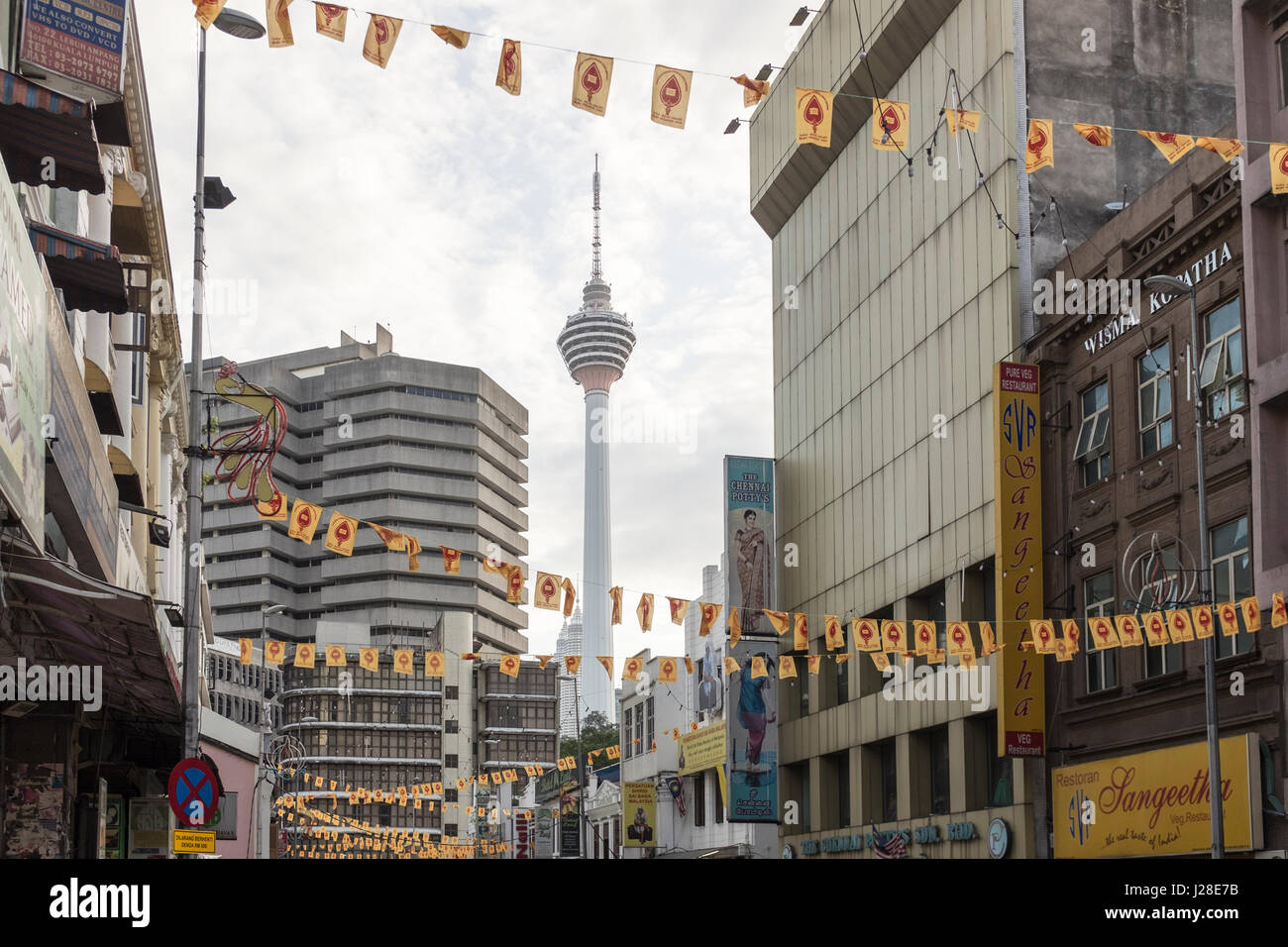 The KL Tower is seen through the buildings in downtown Kuala Lumpur, Malaysia Stock Photo
