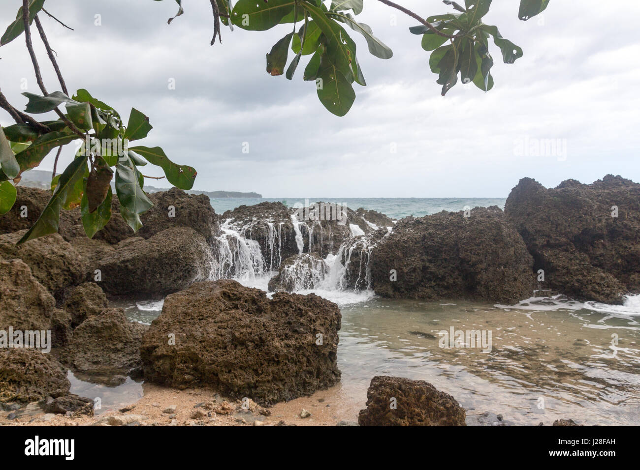 Jamaica, Port Antonio, Wave breakers, Rock wall in the sea Stock Photo