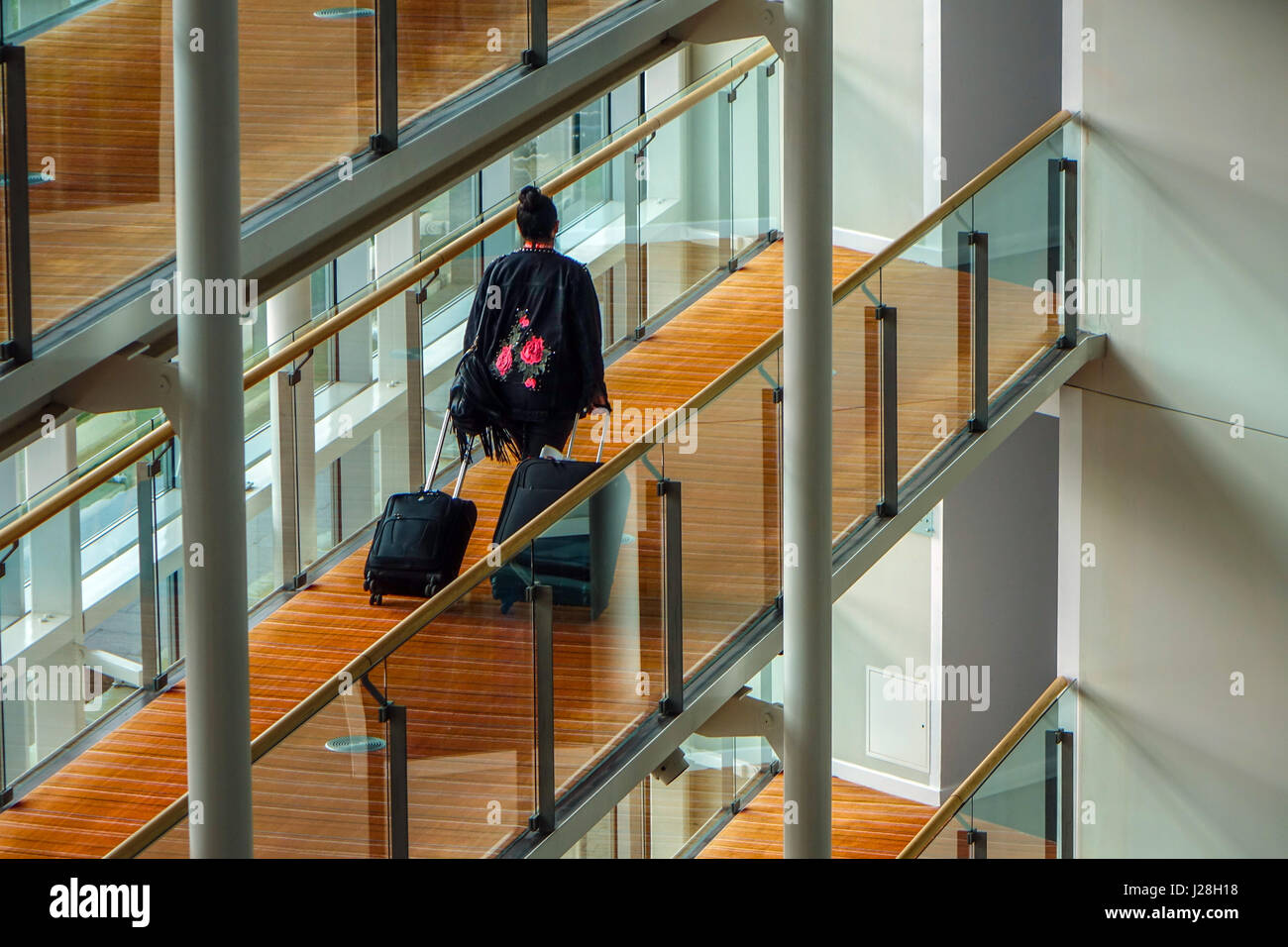 Solitary female traveller at Radisson Blu Airport hotel at London Stansted airport Stock Photo