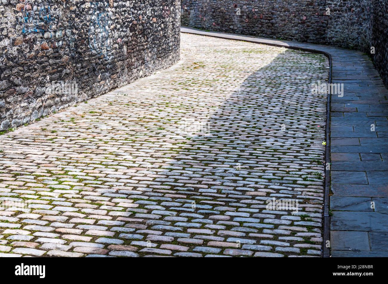 Cobbled lane street and old dockside walls in Bristol, UK Stock Photo