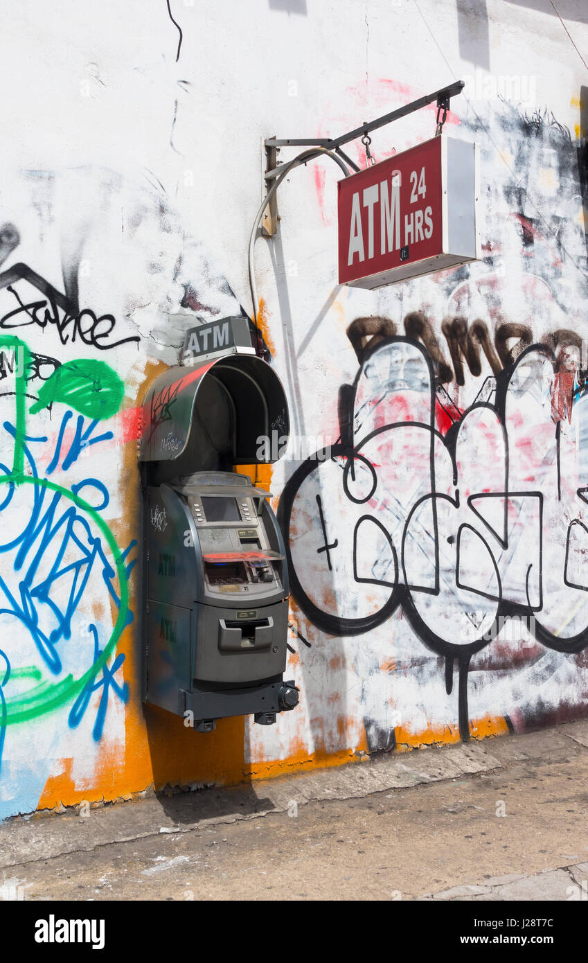 ATM machine on a rough street in New York City Stock Photo