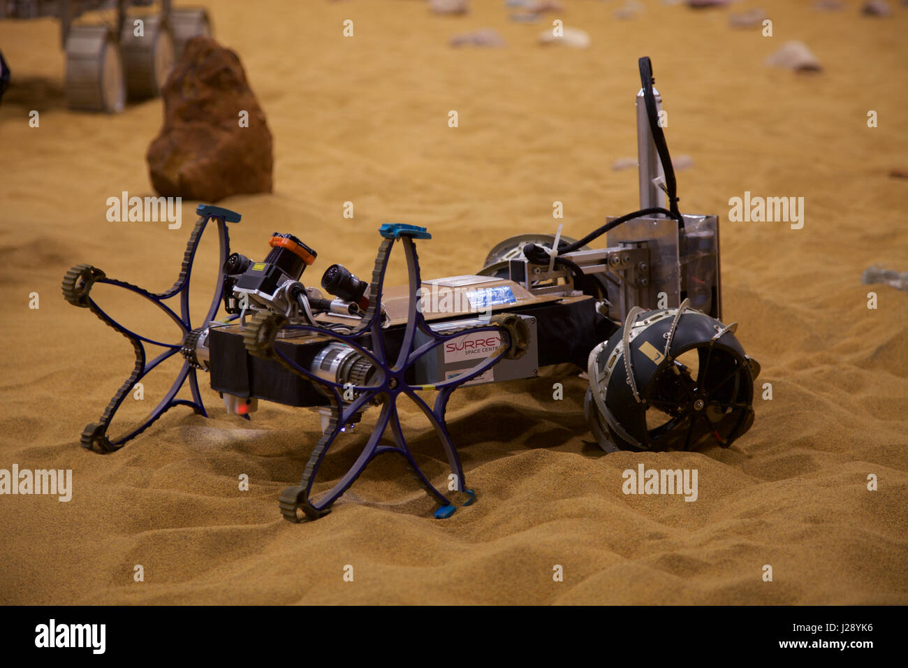 A small scout prototypes for the ESA ExoMars rover mission to Mars is tested by Airbus in a warehouse made to look like the Red Planet Stock Photo