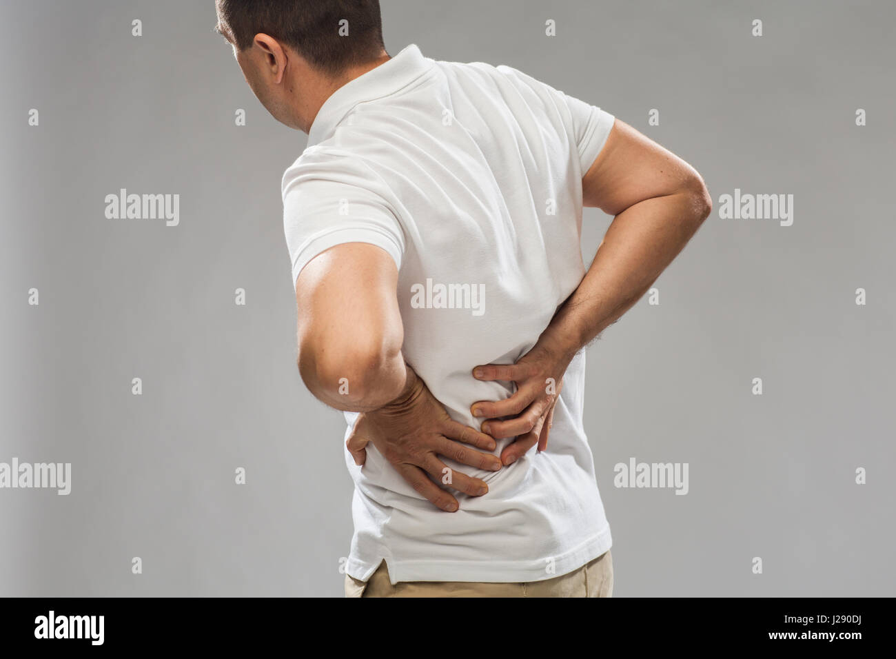 close up of man suffering from backache Stock Photo